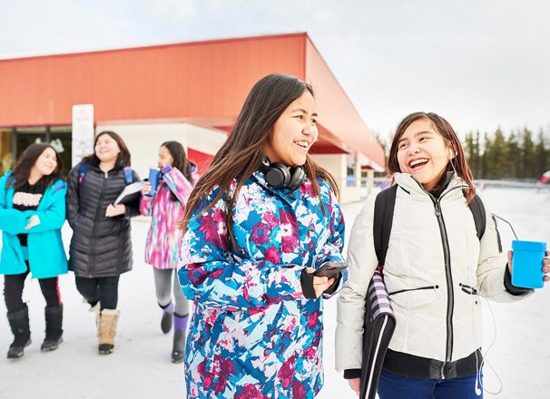 Young students leaving school during the winter.