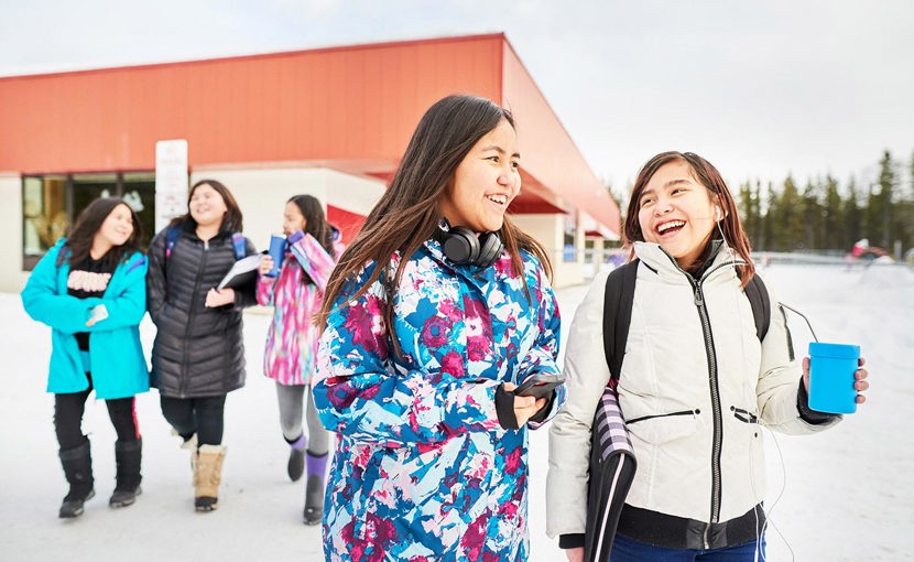 Young students leaving school during the winter.