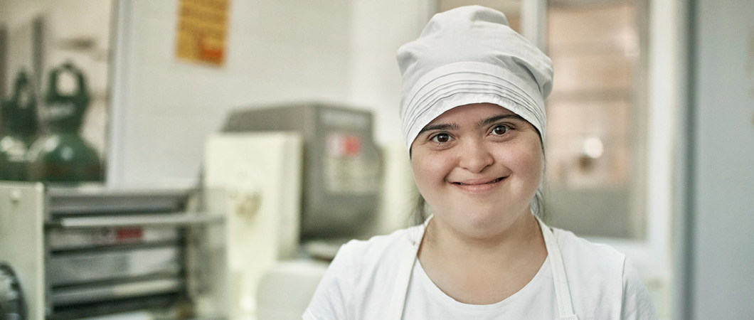 A happy worker in a pasta factory.