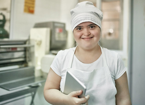A happy worker in a pasta factory.