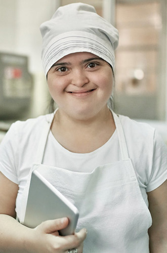 A happy worker in a pasta factory.
