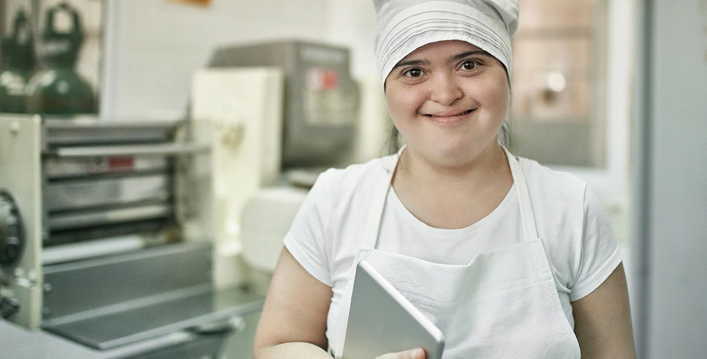 A happy worker in a pasta factory.