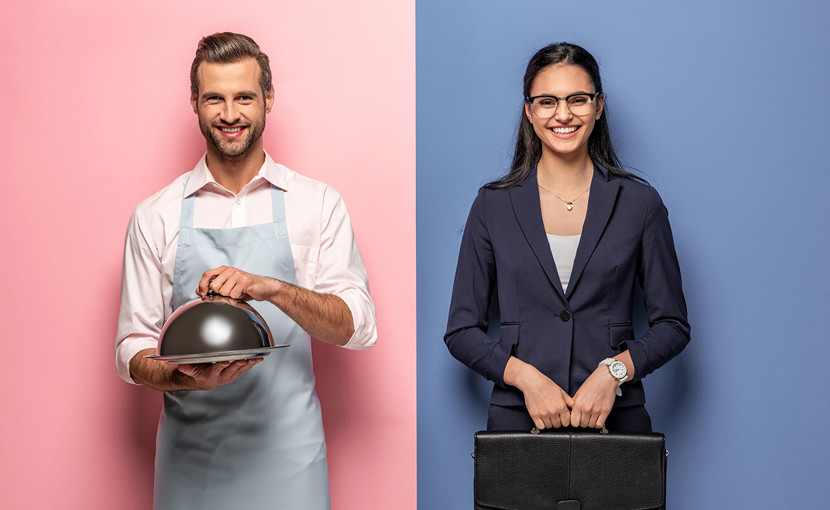 2 people carrying different work items.