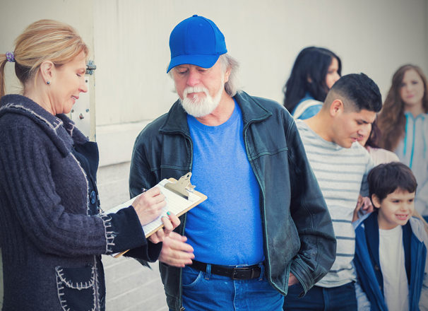 People line up for assistance at a shelter.