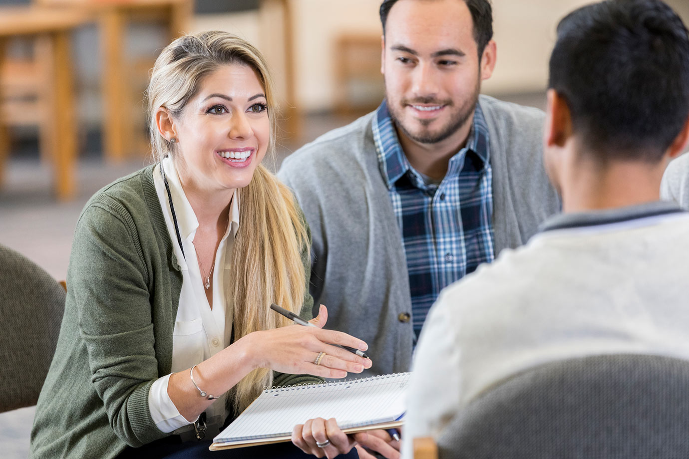3 people in a business meeting