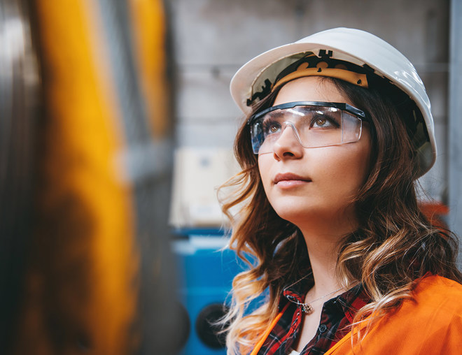 Person wearing a hard hat and PPE