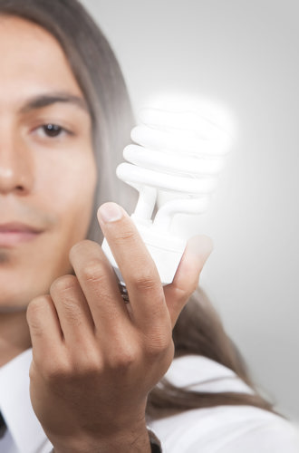 Person holding a lightbulb