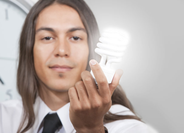 Person holding a lightbulb