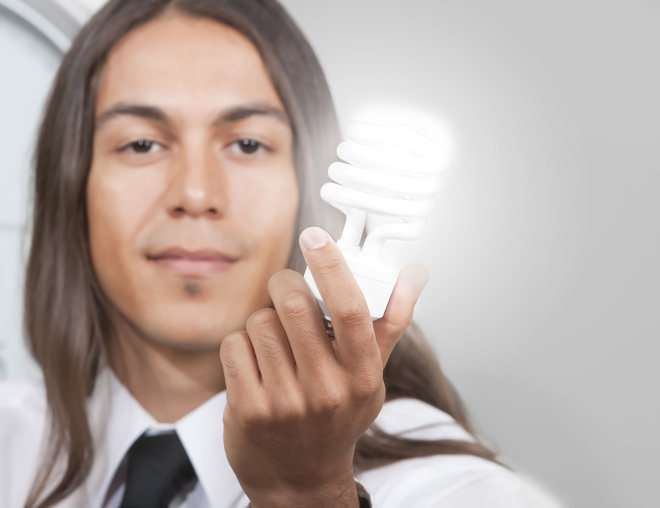 Person holding a lightbulb