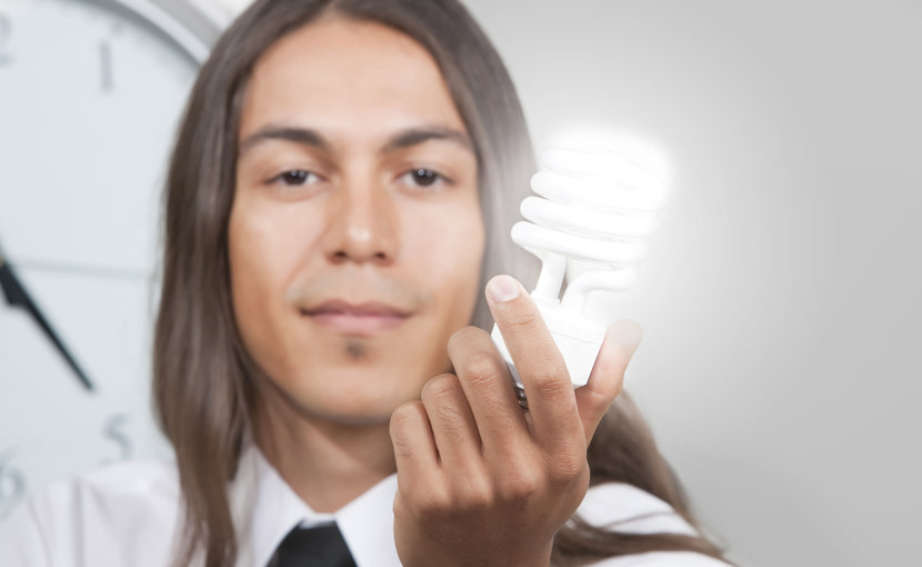 Person holding a lightbulb