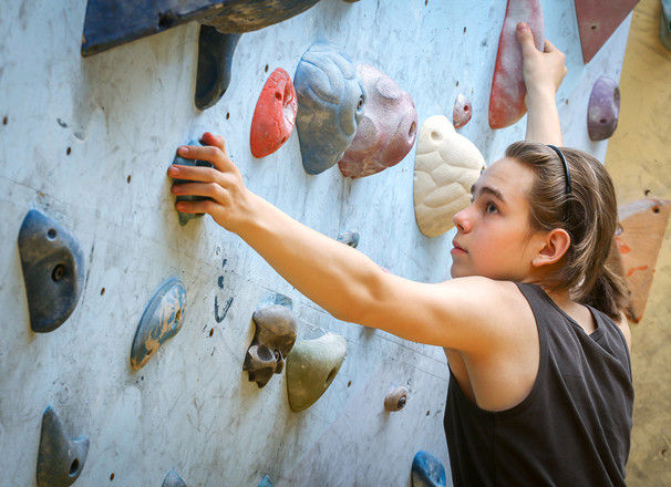 youth on climbing wall