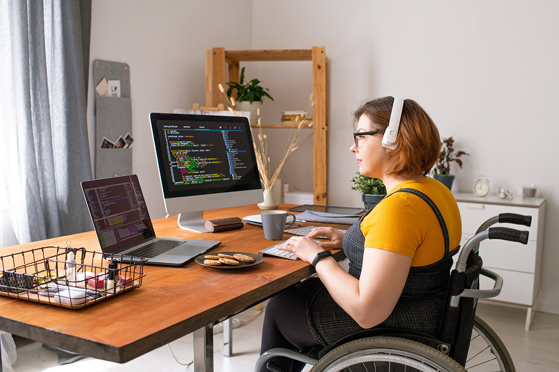 Coder in Wheelchair Working From Home