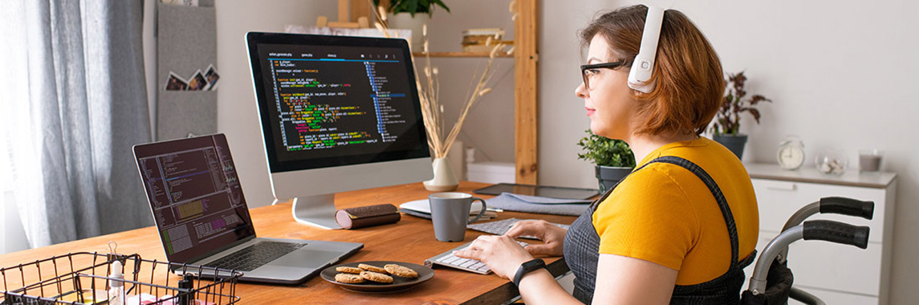 Coder in Wheelchair Working From Home