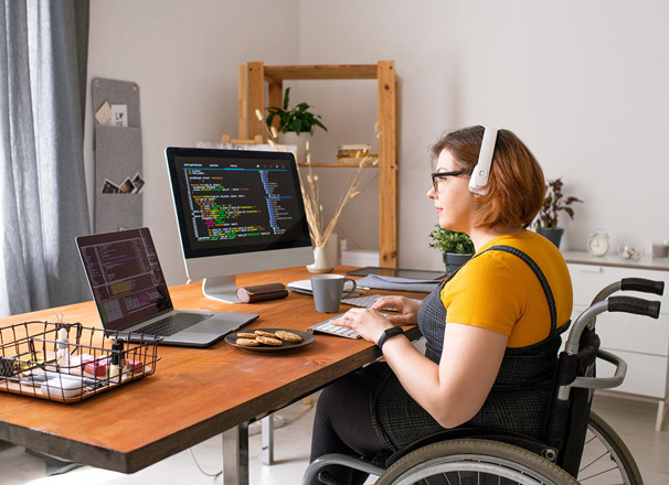 Coder in Wheelchair Working From Home