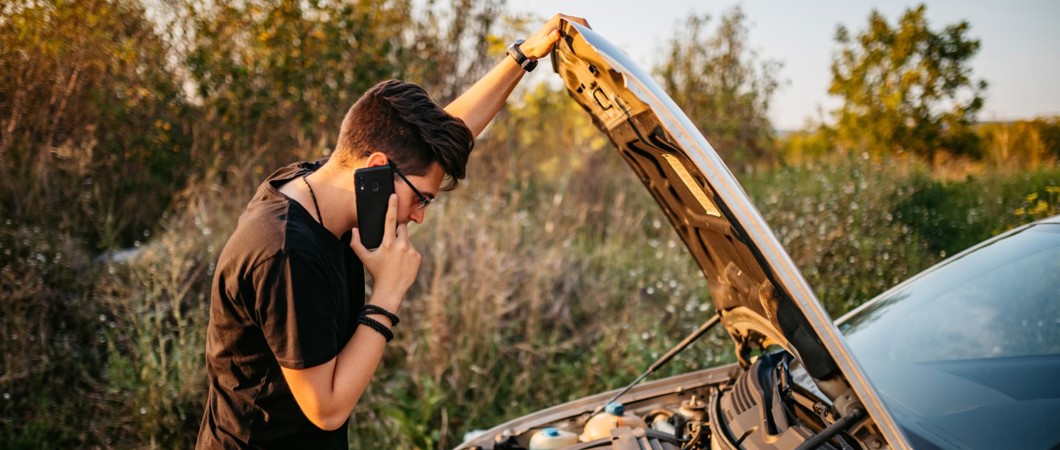 person dealing with car problem