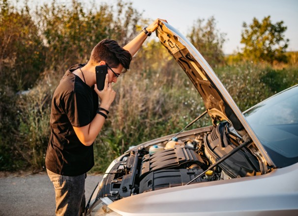 person dealing with car problem