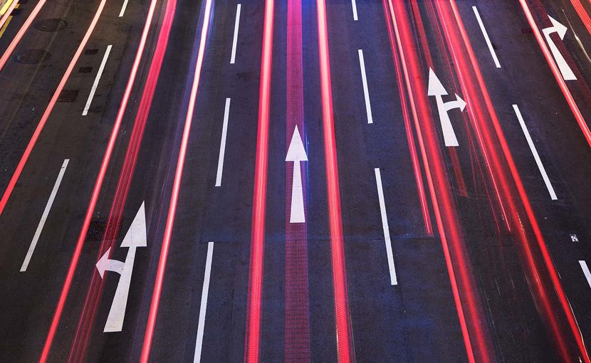 Arrows on a roadway at night