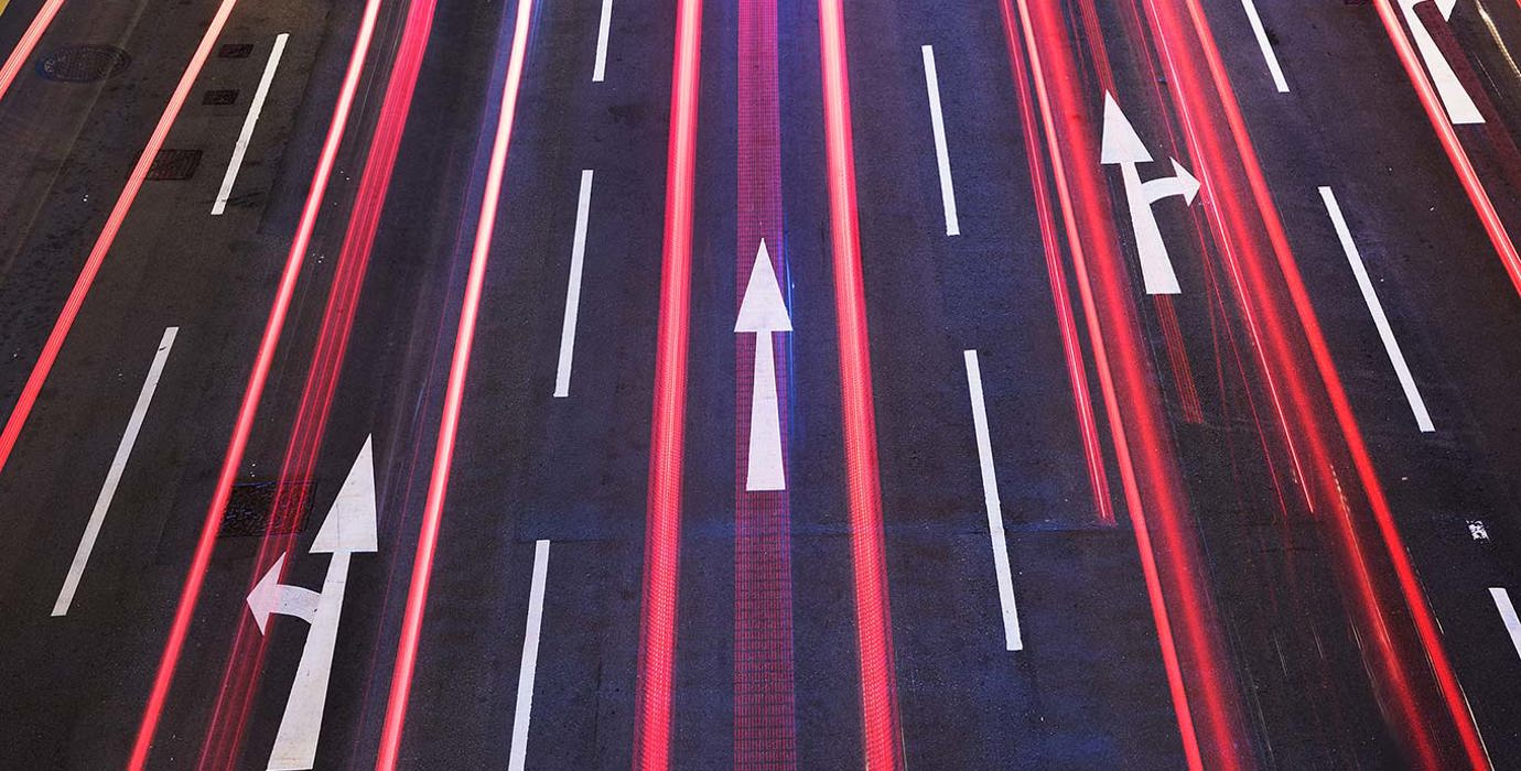 Arrows on a roadway at night