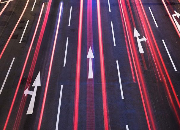 Arrows on a roadway at night