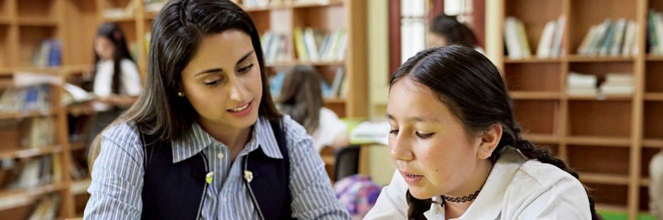 Person helping another read