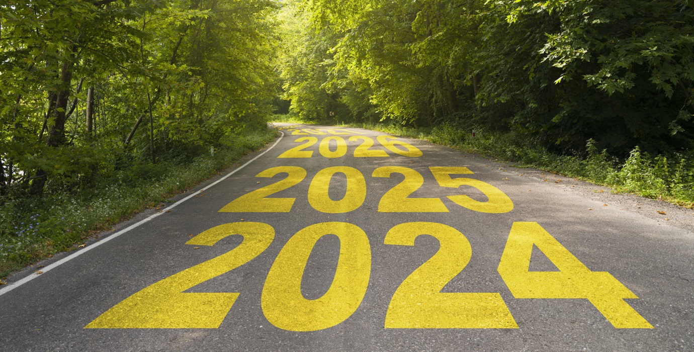 The years 2024, 2025, and 2026 shown consecutively on a paved road. 