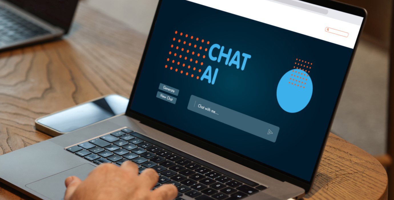 Person looking at an artificial intelligence (AI) chatbot page on a laptop.