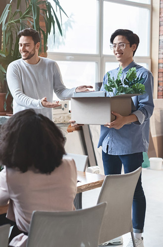 team cheering newcomer in office, manager introducing new employee