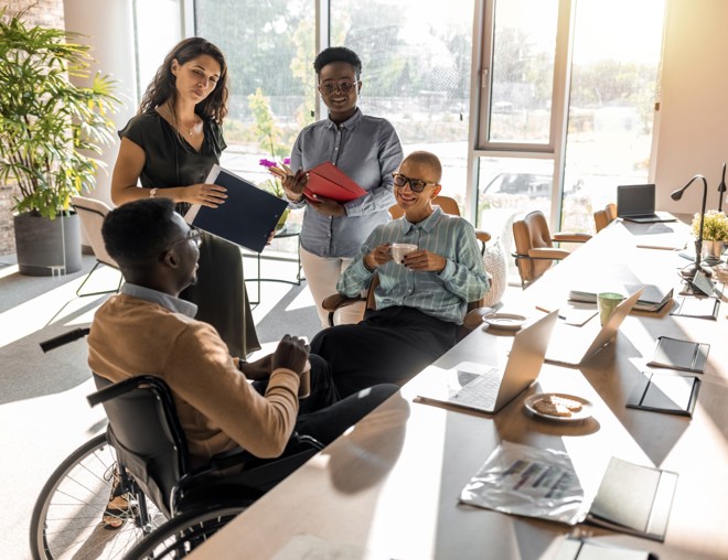 Group of coworkers having a fun conversation.