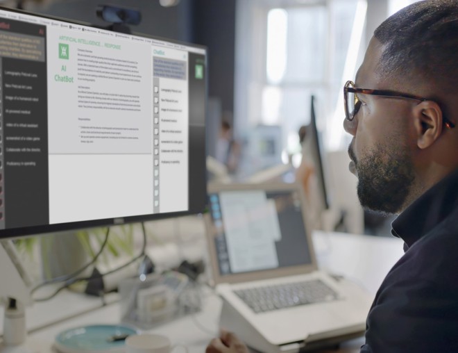 Person using desktop computer to access generative AI software.