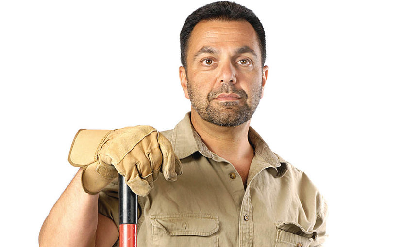 janitor standing with mop