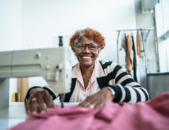 Self-employed person at sewing machine