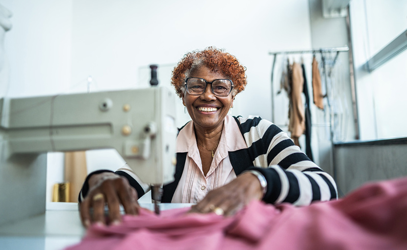 Self-employed person at sewing machine