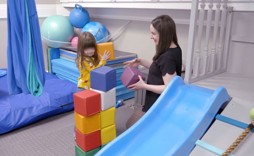 occupational therapist with child