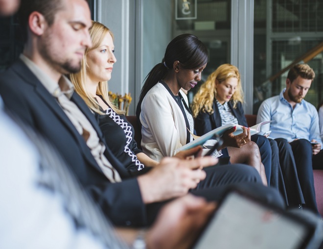 Group of people waiting for a job interview.