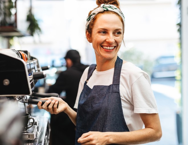 A Barista preparing coffee.